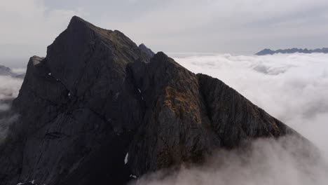 Aerial-view-of-Segla-mountain-above-the-sky,-Norway-during-summer