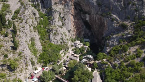 Aerial-Overhead-View-Of-Blagaj-Tekija,-A-Cliffside-Monastery-In-Bosnia-and-Herzegovina