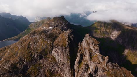 Aerial-view-of-Segla-mountain-above-the-sky,-Norway-during-summer