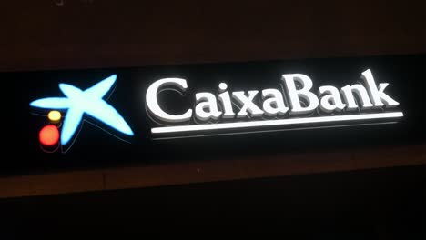 Spanish-largest-savings-bank-Caixa-Bank-logo-at-nighttime