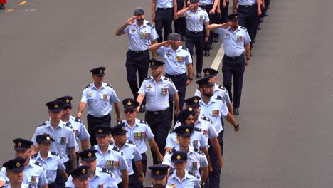 Disciplined-Royal-Australian-Air-Force-service-people,-uniformly-marching-down-the-street,-participating-Anzac-Day-parade,-paying-respect-to-those-who-served-and-sacrificed,-close-up-shot