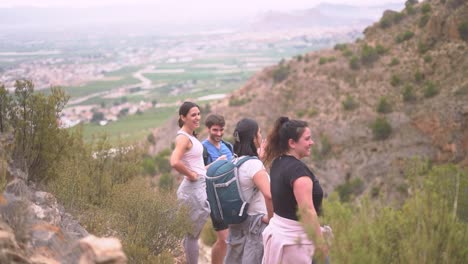 Hikers-group-walk-along-a-rout-in-the-mountain