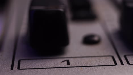 Channel-1-on-Mixing-Console,-Moving-Fader-Up-and-Increasing-Sound-Volume,-Macro-Close-Up
