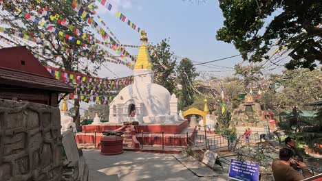 Moving-towards-a-white-stupa-with-a-face-and-golden-top