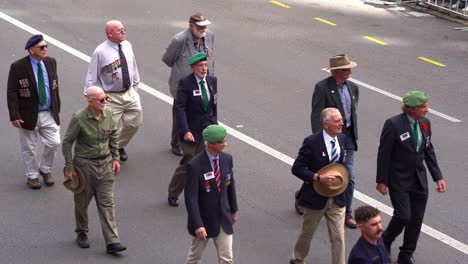 Representatives-from-the-Papua-and-New-Guinea-Infantry-Battalion-walking-down-the-street-of-Brisbane-city,-participating-in-the-annual-Anzac-Day-parade-tradition