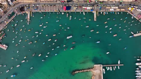 Drone-top-down-shot-of-fishing-boat-anchored-in-the-bay