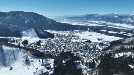 Aerial-establishing-shot-of-Japans-Nozawaonsen-Mountain-Ski-Resort-Village