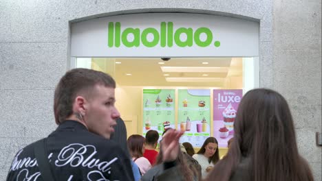 Clients-queue-in-line-to-buy-frozen-yogurt-at-the-Spanish-franchise-brand-Llaollao-store
