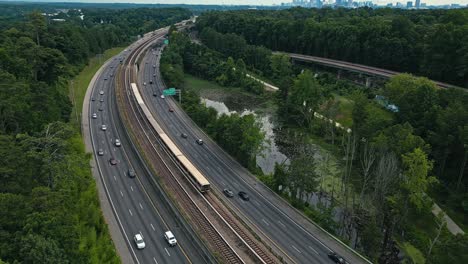 Train-And-Cars-Passing-Through-Georgia-State-Route-400-With-PATH400-In-Buckhead,-Atlanta,-Georgia