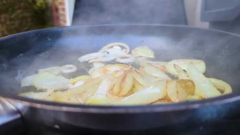 Onions-Sizzling-in-Hot-Pan-Outside-with-Steam