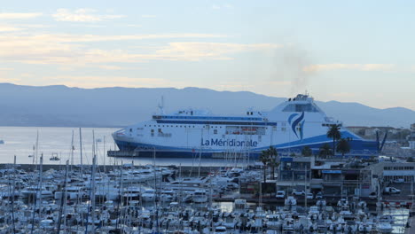 Ferry-ship-anchored-in-port-of-Ajaccio-at-sunset,-Corsica,-France