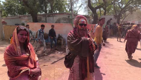 pov-shot-many-men-are-taking-photo-with-baba-sadhu-one-brother-is-standing-side-and-taking-photo-with-baba-sadhu