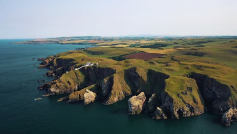 Scotland’s-Rocky-Coastal-Elegance:-Aerial-Views-of-St-Abbs-Head-Cliff-and-Nature-Reserve,-Scottish-Landmark