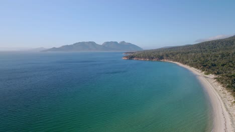 Slow-panning-shot-of-Freycinet-National-Park-landscape-with-hills-at-background-during-sunny-day-in-Tasmania,-Australia