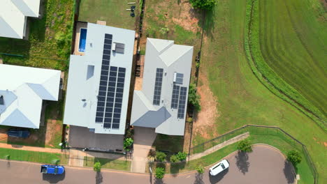Aerial-Drone-of-House-Next-To-Gated-Field-at-End-of-Street-with-Solar-Panels,-Top-Down-Descend