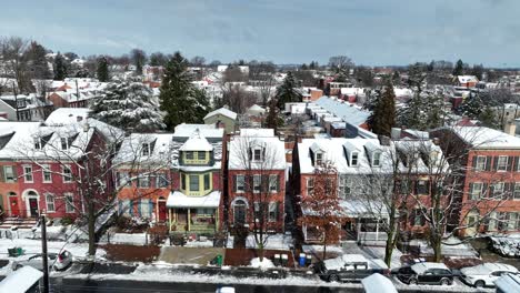 Row-of-colorful-townhouses-with-snowy-roofs