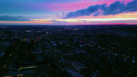 Arnhem-historic-city-centre-epic-urban-drone-shot-during-pink-sunset-twilight