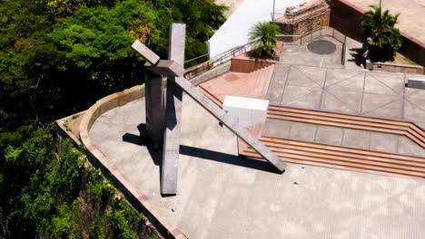 Aerial-view-of-Monumento-da-Cruz-Caida-and-the-city-around,-Salvador,-Bahia,-Brazil