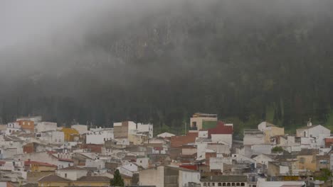 humble-houses-on-the-side-of-a-mountain-surrounded-by-fog