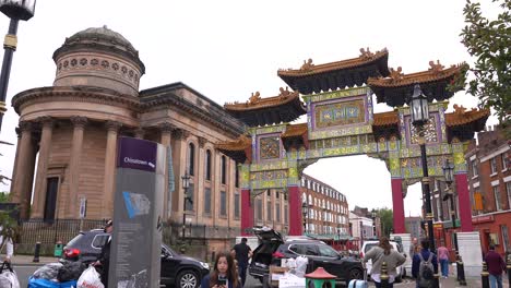 Chinatown-Gate-in-Liverpool,-England-UK,-People-on-Nelson-Street-and-Paifang,-Slow-Motion