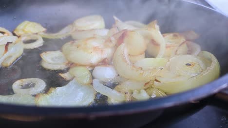 Slow-Motion-Chopped-White-Onions-in-Hot-Pan-with-Oil