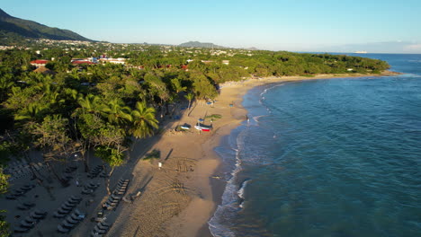 Sandy-beach-of-Costa-Dorada-Beach-with-tourist-at-golden-sunset