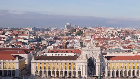 Aerial-pan-across-triumphant-arch-in-downtown-Lisbon-Portugal-city-center