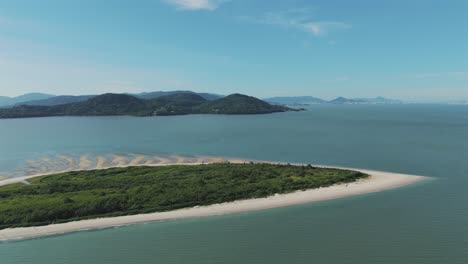 Description:-Pontal,-nestled-alongside-Daniela-Beach,-emerges-as-a-magical-destination-with-the-stunning-backdrop-of-Florianopolis'-majestic-mountains