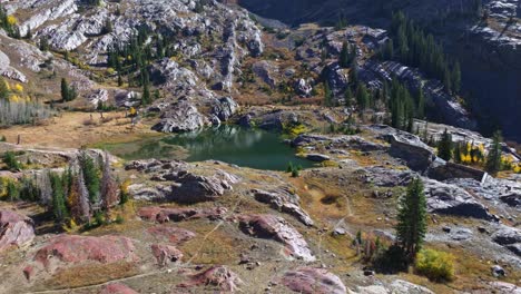 Aerial-Flying-towards-Lake-Lillian-in-Big-Cottonwood-Canyon-Utah-with-beautiful-Rocky-Mountains-landscape