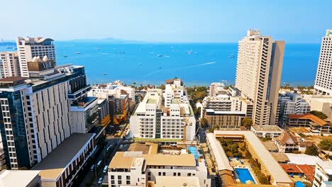 View-of-Pattaya-beachfront-from-a-Skybar,-overlooking-at-the-different-accommodations-and-establishments-by-the-beach-at-Chonburi-province-in-Thailand