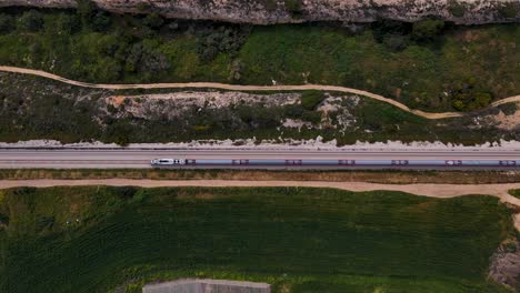 Passenger-Train-On-Railway-Track-Through-Field-In-Megadim,-Northern-Israel