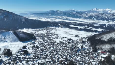 Aerial-establishing-pull-away-shot-of-Japans-Nozawaonsen-Mountain-Ski-Resort-Village