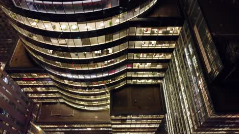 Descending-past-the-round-glass-structure-of-CGI-building-in-Montreal