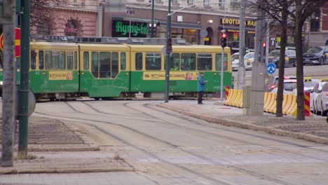 Foreshortened-city-view-as-public-transit-tram-turns-street-corner