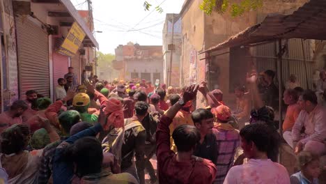 pov-shot-Many-people-are-reaching-the-temple-from-Harsol-Ulash-where-many-people-are-walking-to-the-temple-where-people-are-dancing-and-waving-different-colors