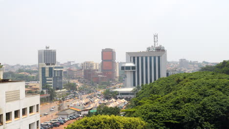 Caisse-Autonome-d'Amortissement-Building-Beyond-The-Lush-Green-Trees-In-The-Park-In-Yaounde,-Cameroon,-Africa