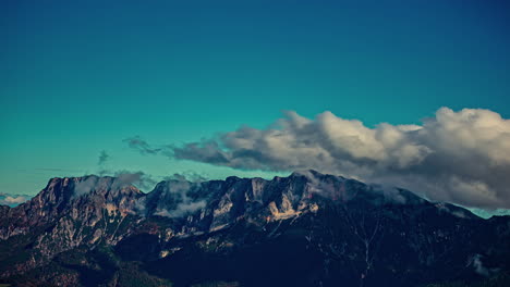 Cumulus-clouds-flowing-over-Austrian-alps,-time-lapse-view