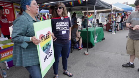 Members-of-a-gun-control-group-stand-in-front-of-their-booth-at-the-annual-MidMo-PrideFest-in-Columbia,-MO