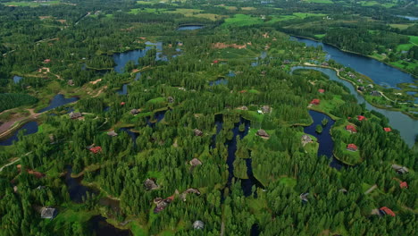 Birds-eye-view-of-the-Kemeri-bog,-large-houses-and-villas-among-lakes-and-forests