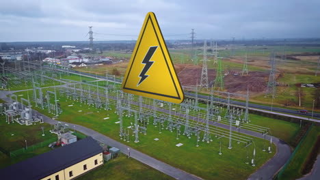 Caution-graphic-for-electrical-shock-over-a-power-substation---aerial-orbit