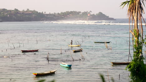 Fisherman-and-his-boat,-Bali-coast