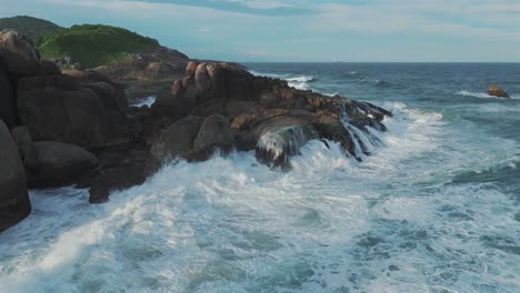 Captivating-spectacle-of-waves-crashing-against-rocky-shores,-a-mesmerizing-display-of-nature's-power-and-beauty