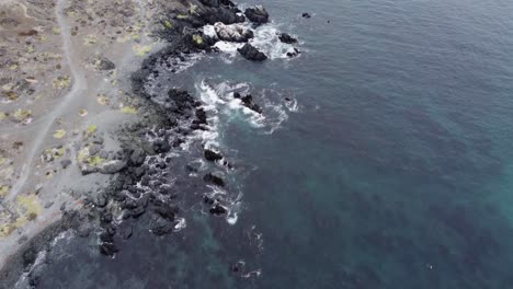 Flat-light-flyover-of-rugged-rocky-Pacific-coastline-of-Chile,-aerial