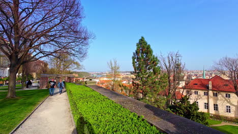 Tourists-walking-in-a-park-with-the-view-over-city