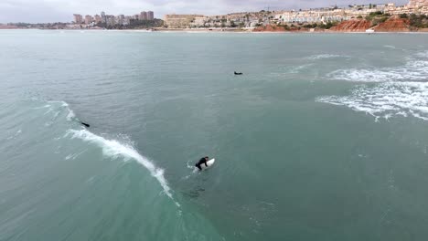 Surfing-waves-drone-view