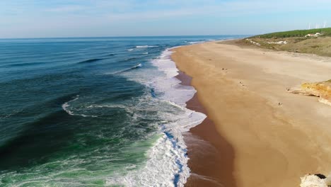 Fly-Above-Famous-Beach-of-North-in-Nazaré,-Portugal