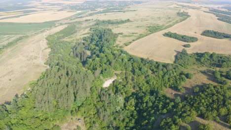 Approaching-drone-anad-slowly-orbiting-around-the-entrance-of-a-cave's-natural-arch-more-commonly-called-Gods-Bridge,-located-near-Vratsa-in-Bulgaria