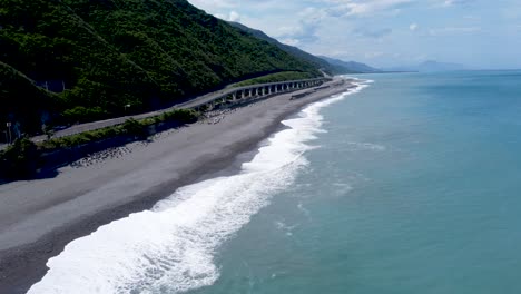 Highway-by-the-sea-and-beautiful-waves-in-a-tropical-country