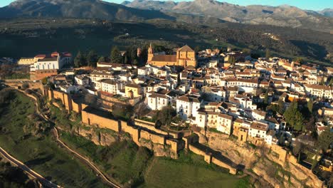 Arabic,-Moorish-Cliff-Walls-In-Ronda-And-Iglesia-de-Santa-Maria-la-Mayor-At-Dusk-In-Andalusia,-Spain