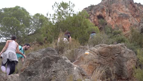 Hikers-group-walk-along-a-rout-in-the-mountain